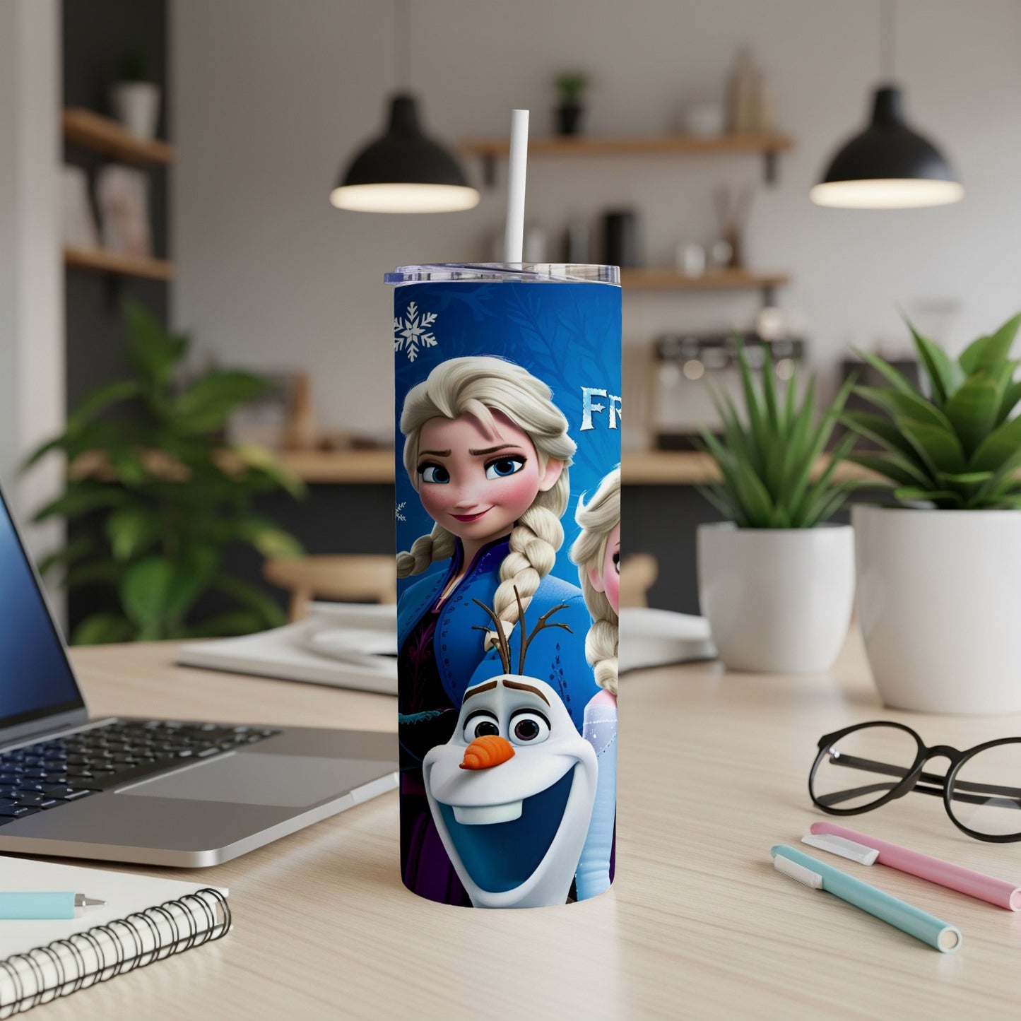 Frozen characters Elsa and Olaf on a blue tumbler with a white straw.