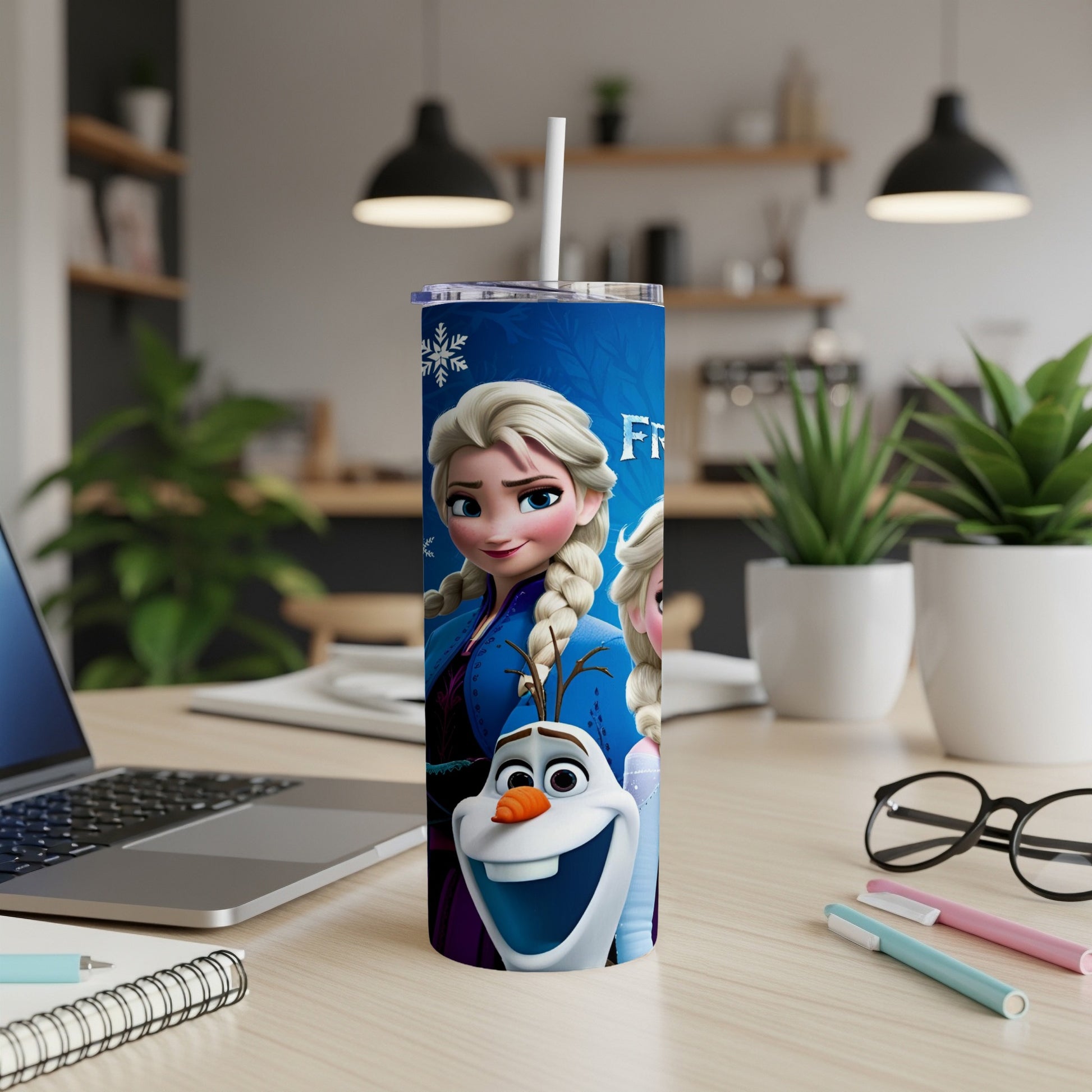 Frozen characters Elsa and Olaf on a blue tumbler with a white straw.
