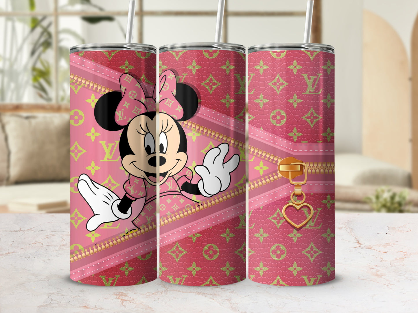 Pink tumbler with Minnie Mouse and LV pattern, featuring a gold zipper.