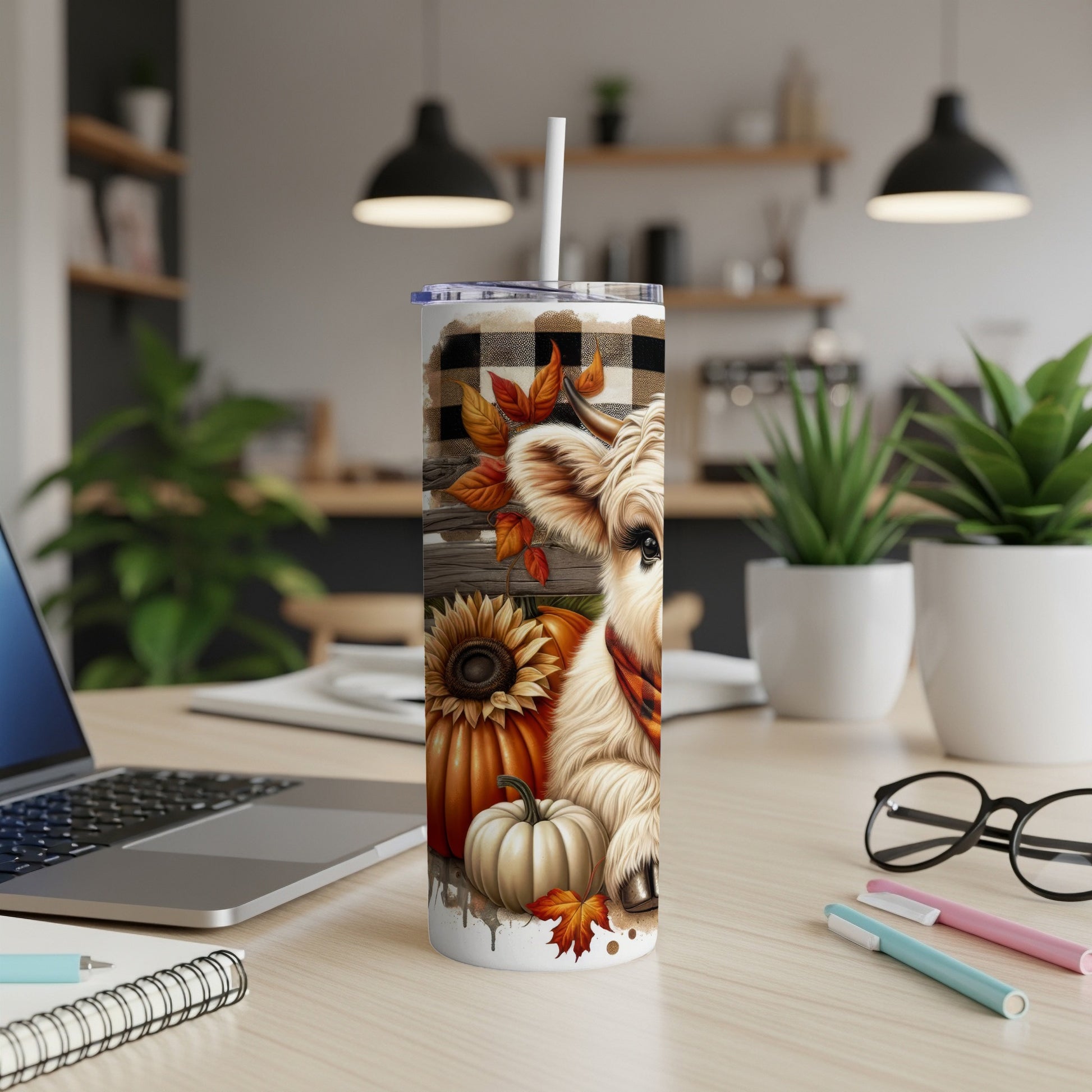 Cow tumbler with pumpkin, sunflower, and plaid details.