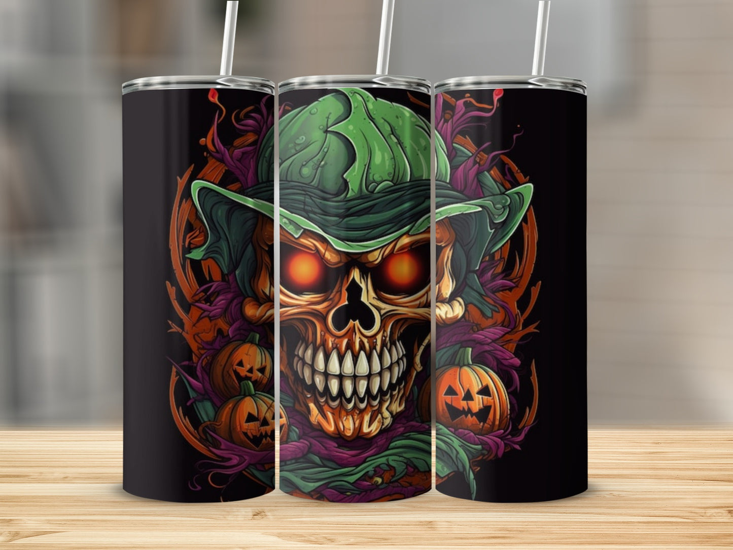 Three tumblers featuring a Halloween-themed skull with glowing eyes and pumpkins.