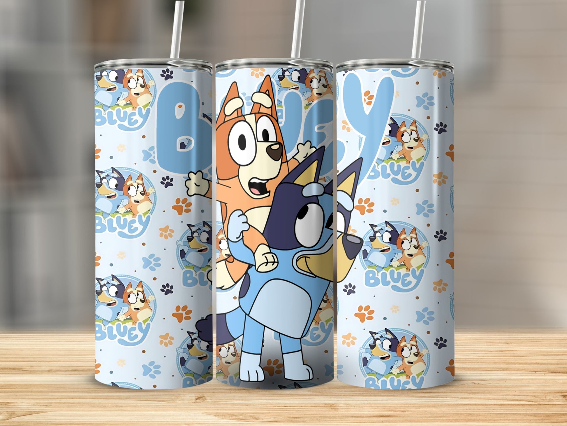 Bluey and Bingo characters on a light blue patterned tumbler.