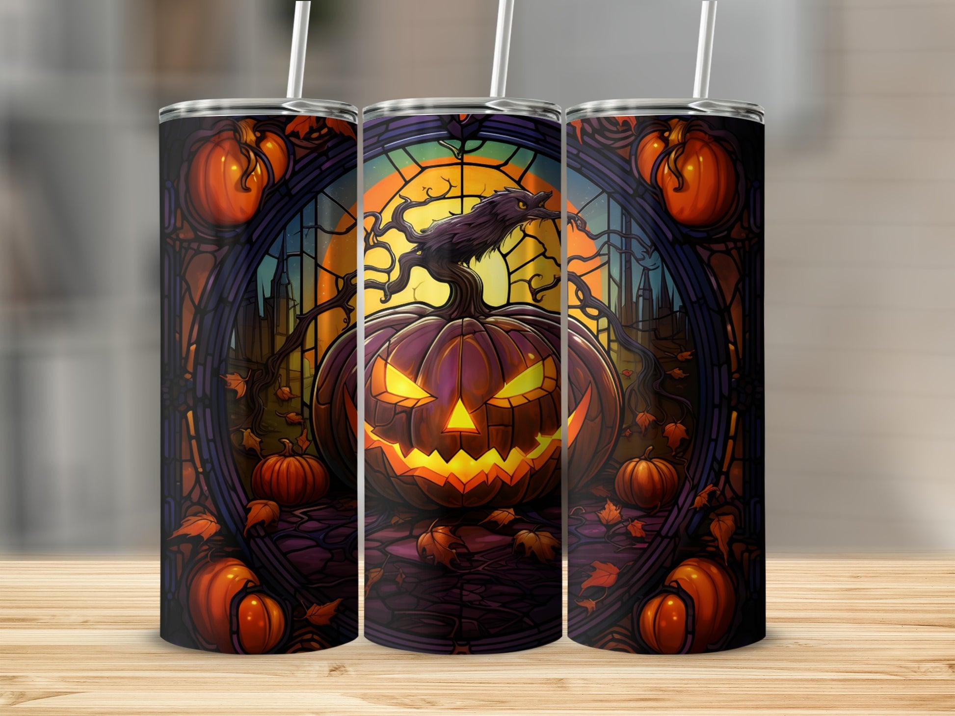 Three tumblers with a spooky Halloween jack-o'-lantern and stained-glass design.