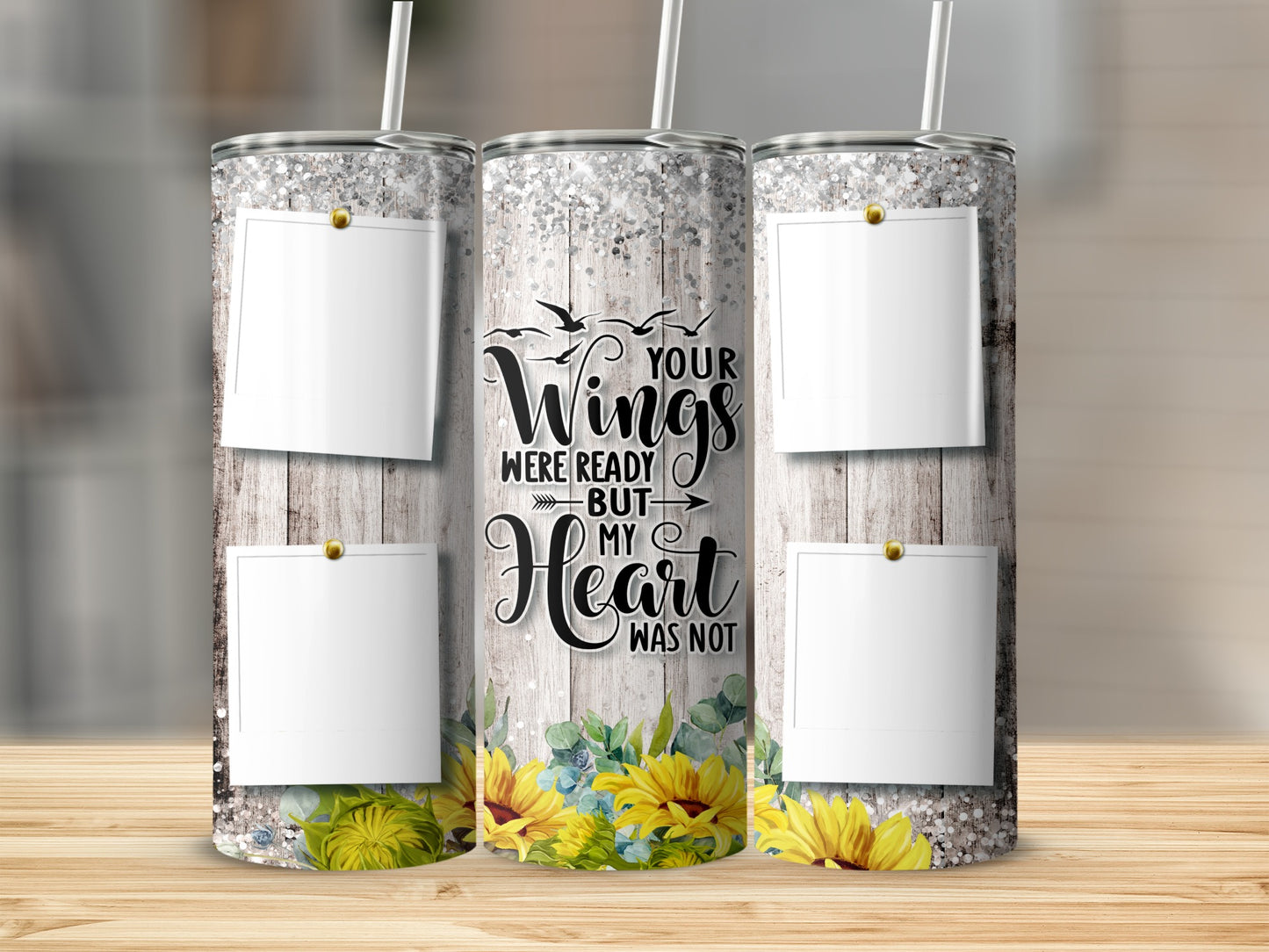 Glittery tumbler with rustic wood background, sunflowers, and photo frames.