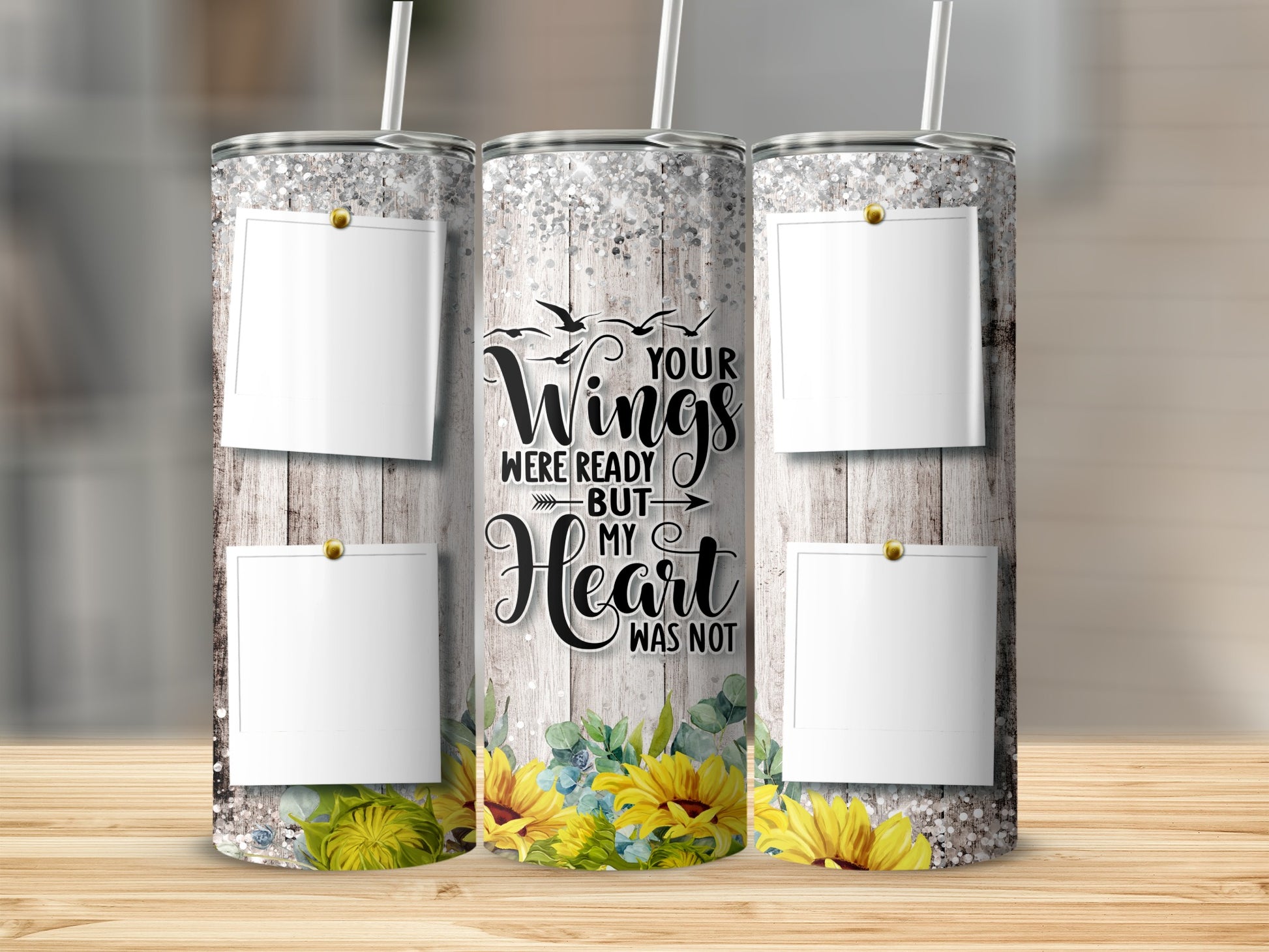 Glittery tumbler with rustic wood background, sunflowers, and photo frames.