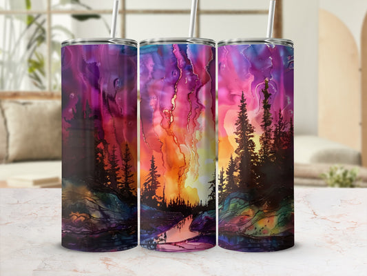 Tumbler with vibrant purple, pink, and orange sunset landscape and pine trees.