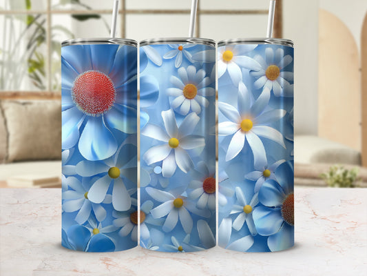 Three blue tumblers adorned with white and yellow daisy floral patterns.