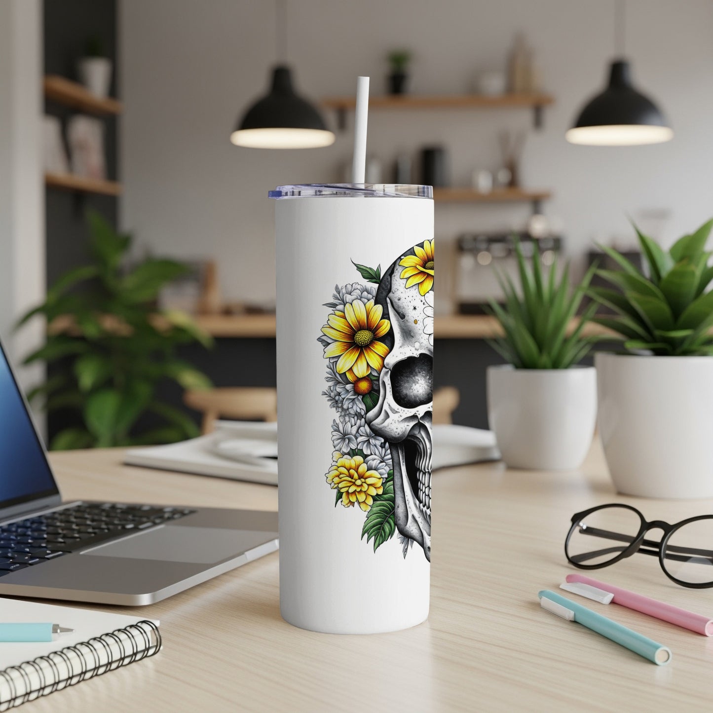 White tumbler with a skull and floral design.