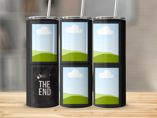 Black tumbler with "THE END" text and image placeholders on a wooden surface.
