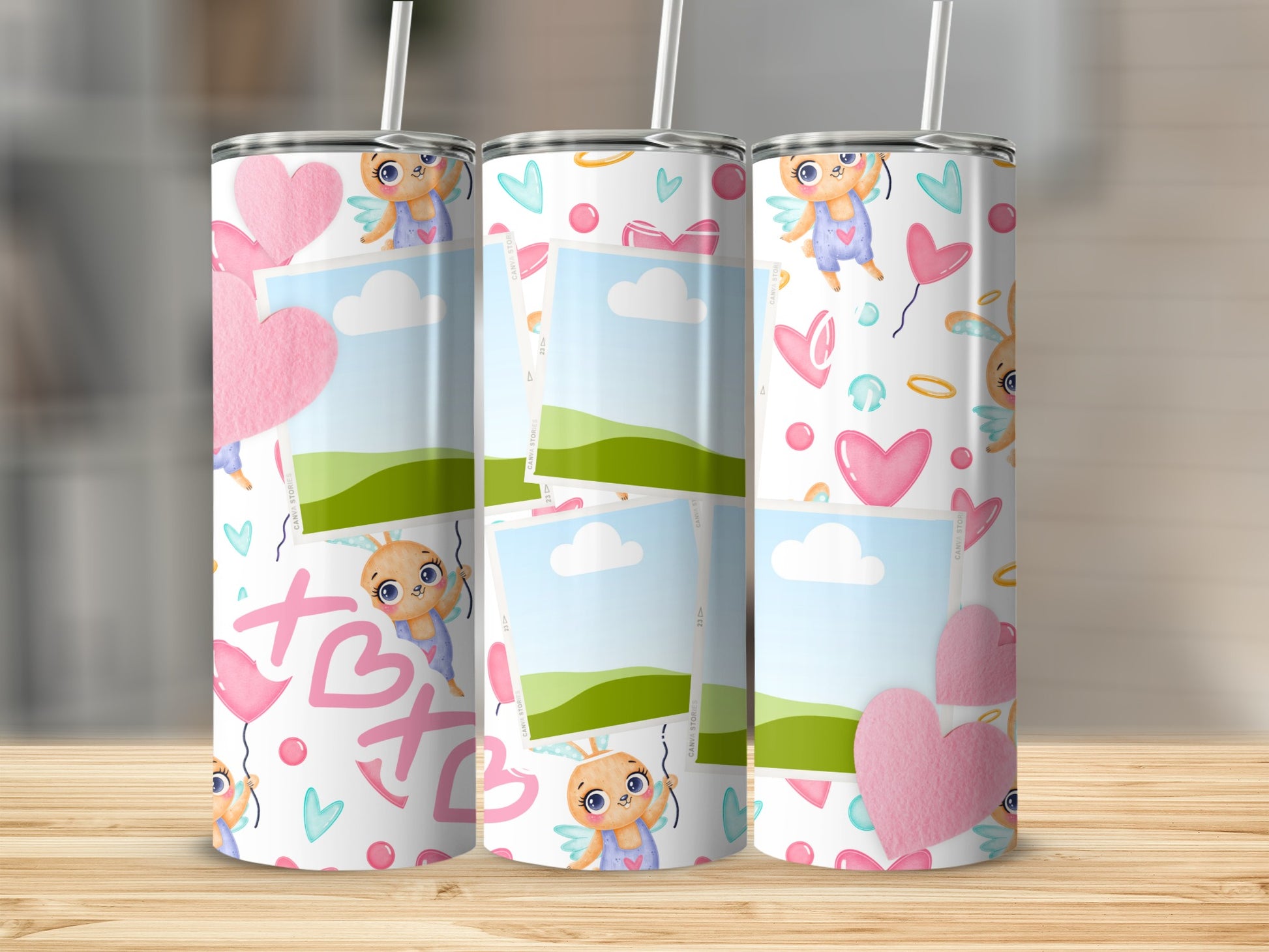 Three skinny tumblers with a cute bunny cupid and heart pattern.