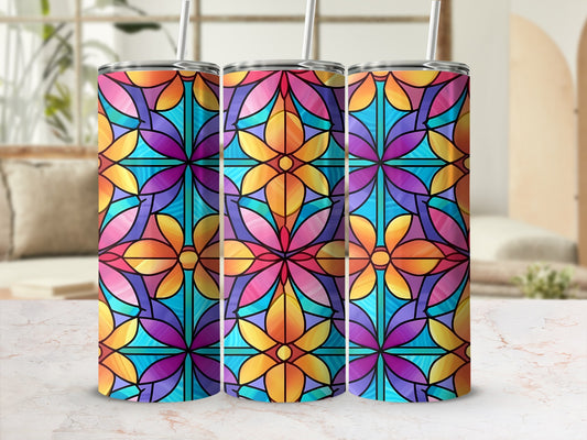 Three stained glass tumblers with floral patterns in vibrant colors.