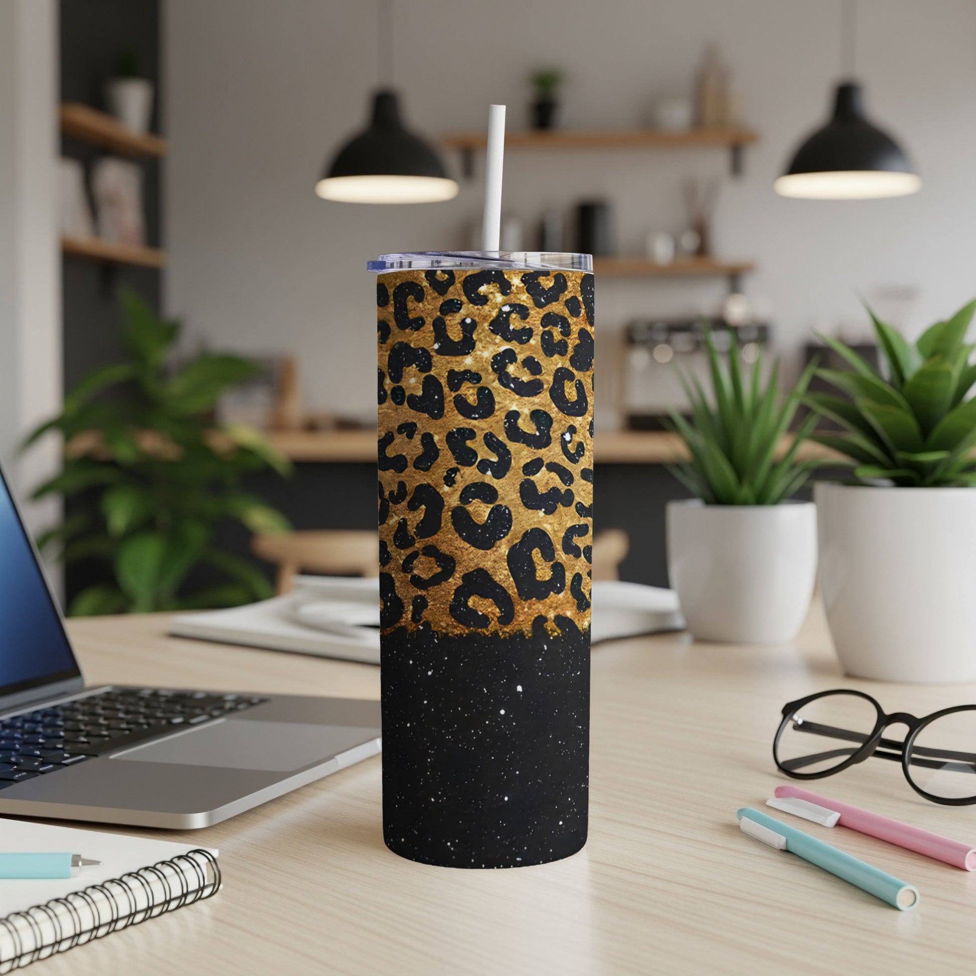 Black tumbler with gold leopard print and glitter base.