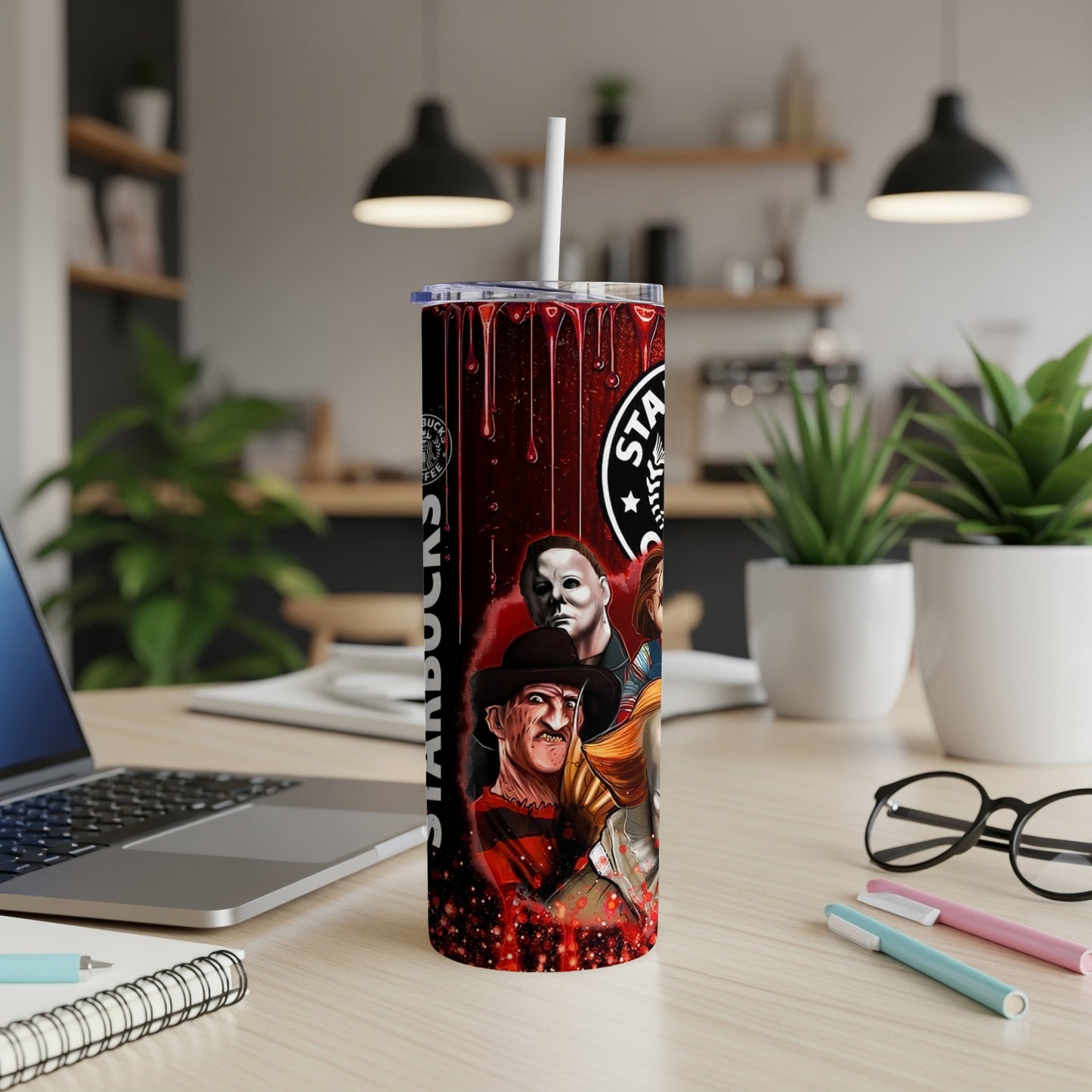 Horror movie characters on a Starbucks-themed tumbler with a red, dripping design.