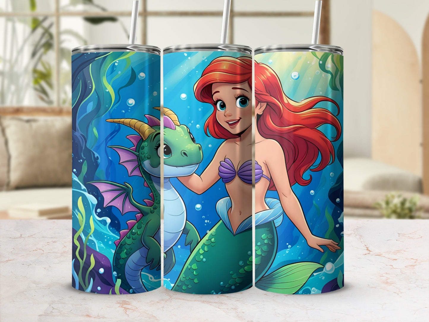 Ariel and Flounder on a tumbler with a dragon and bubbles.
