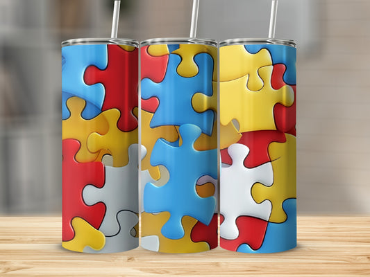 Three tall tumblers with colorful interlocking puzzle piece patterns.