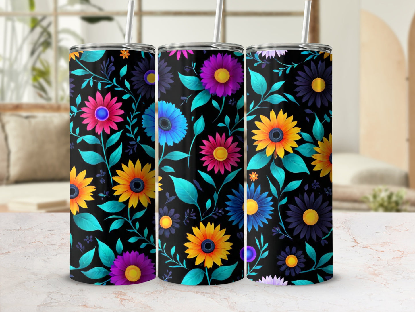 Three tumblers with a colorful floral design on a black background.