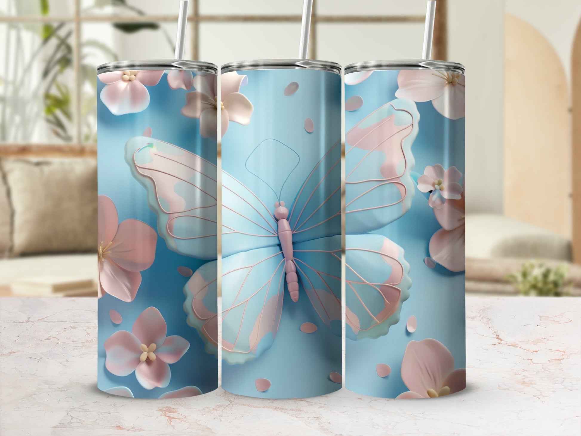 Three light blue tumblers with pastel butterflies and flowers.