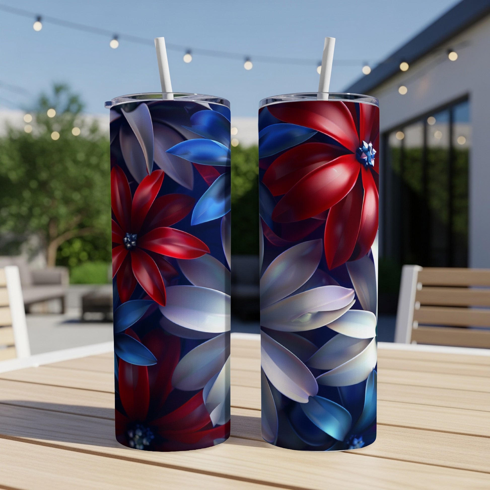 Two tumblers with red, white, and blue floral patterns sit on a table.