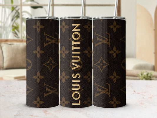 Brown Louis Vuitton monogram tumbler with gold straw.