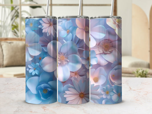 Three tumblers with blue and pink floral patterns and straws.