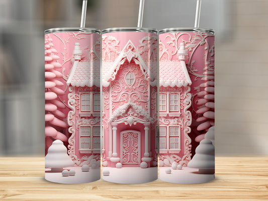 Pink gingerbread house design on three tumblers with trees and snow.