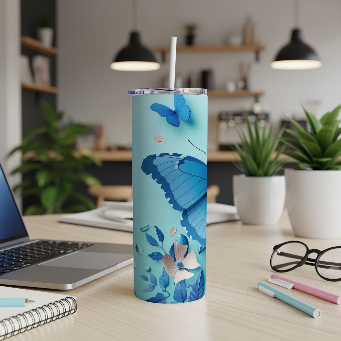 Light blue tumbler with a butterfly and floral design.