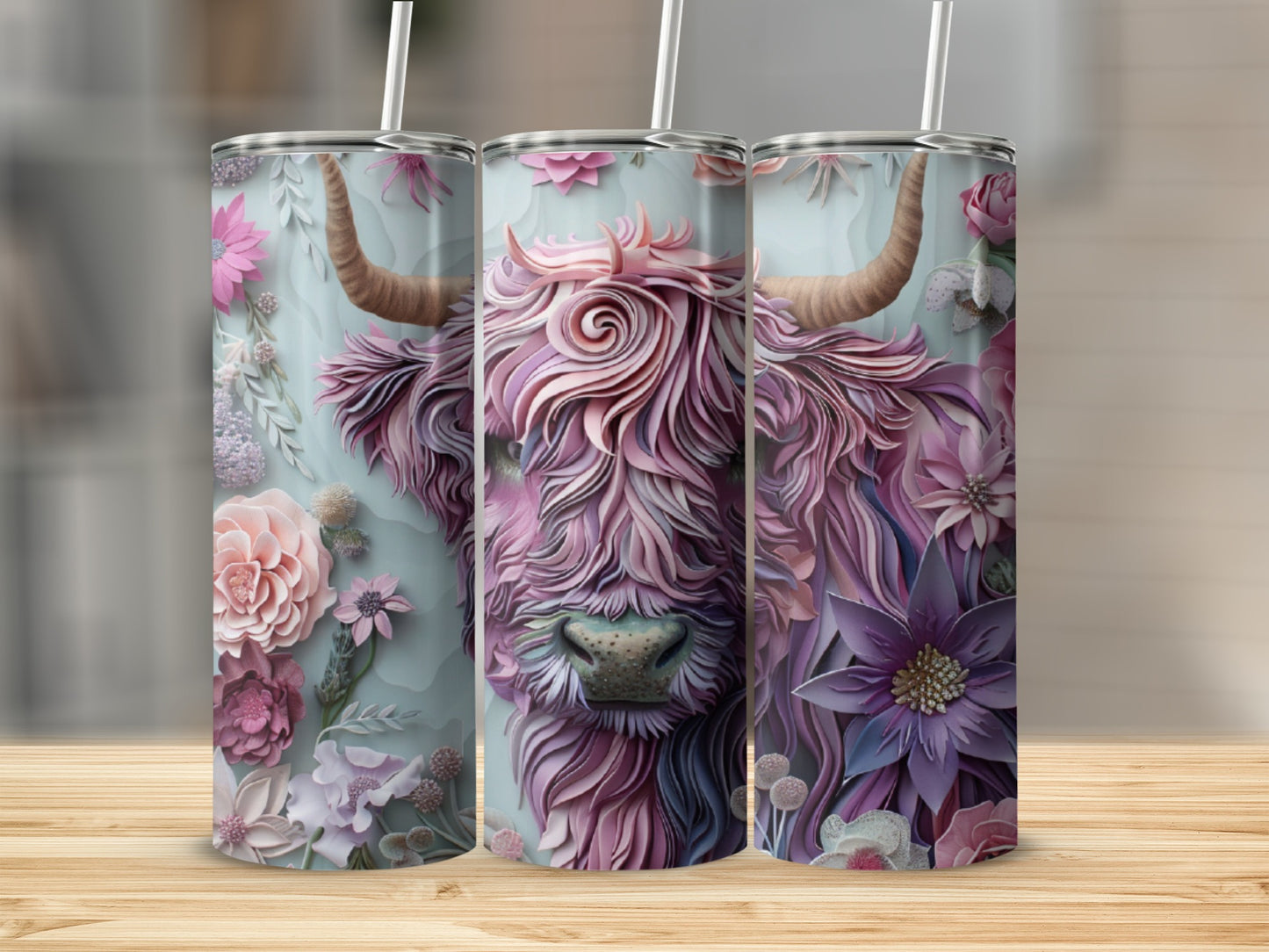 Pink Highland cow with floral accents on three tumblers.