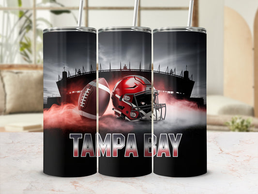 Tampa Bay football helmet and ball with stadium in background.