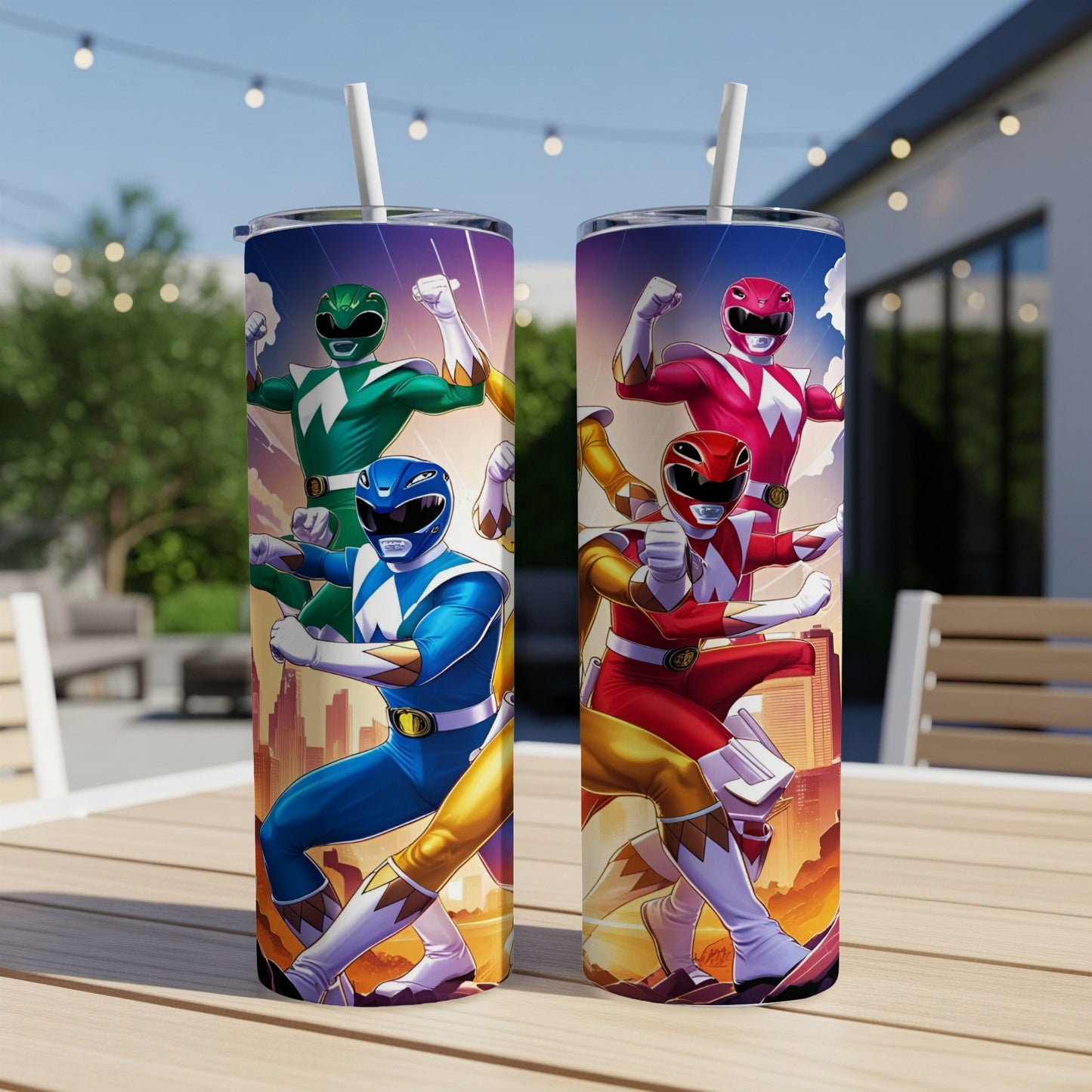 Two Power Ranger tumblers with characters on a table outdoors.