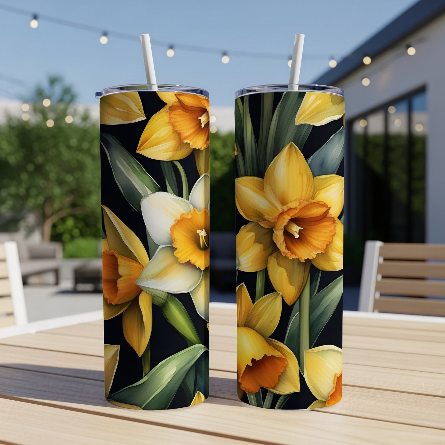 Two tumblers with a yellow daffodil floral pattern on a dark background.