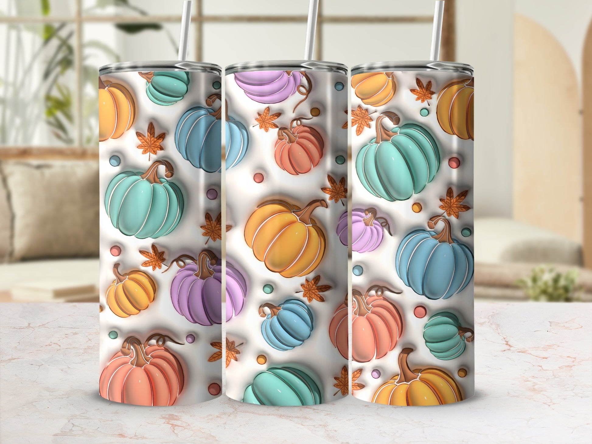 Three tumblers with a pastel pumpkin and leaf pattern.