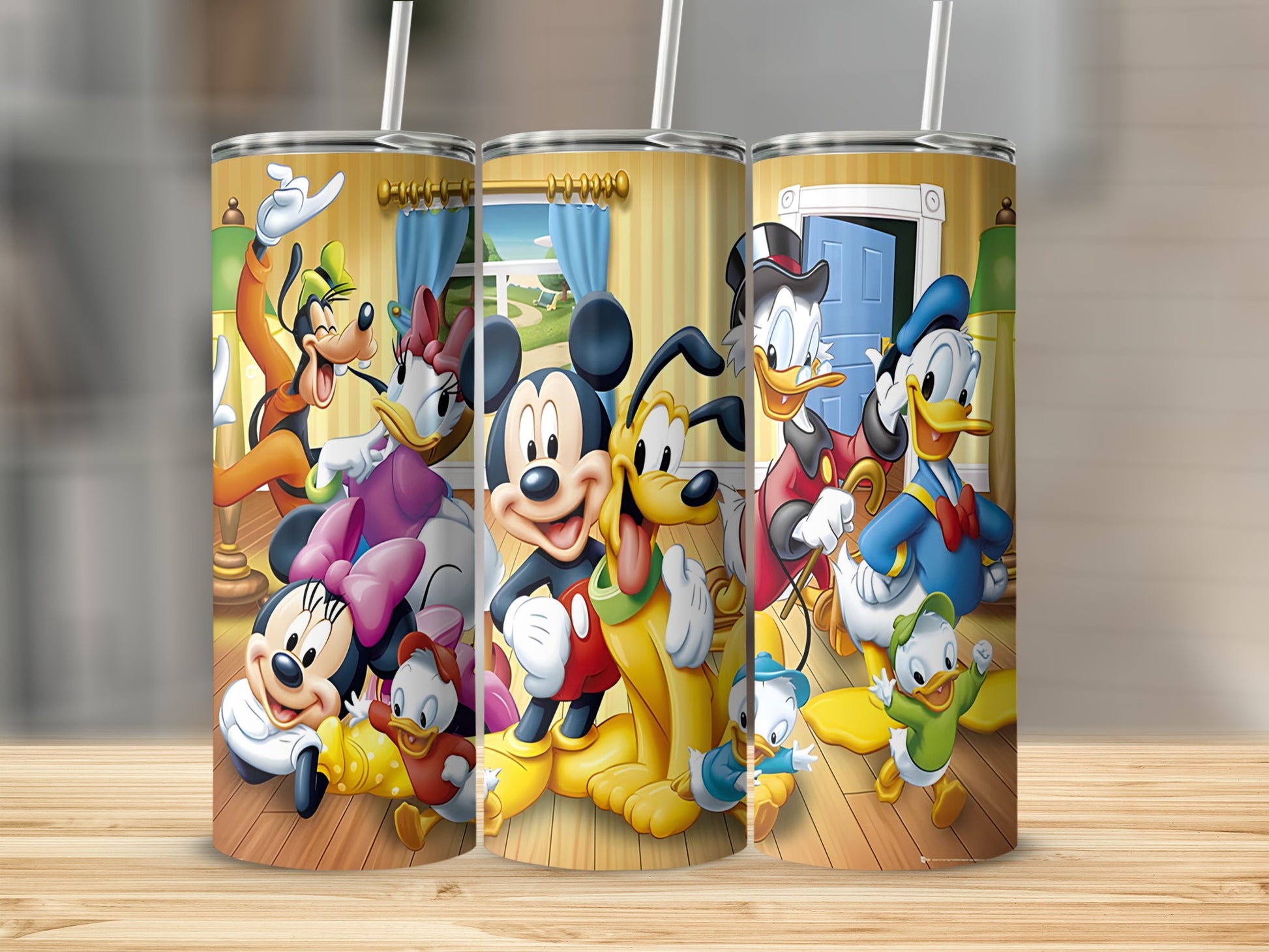 Mickey Mouse, Minnie Mouse, Donald Duck, Goofy, and Pluto characters on three tumblers.