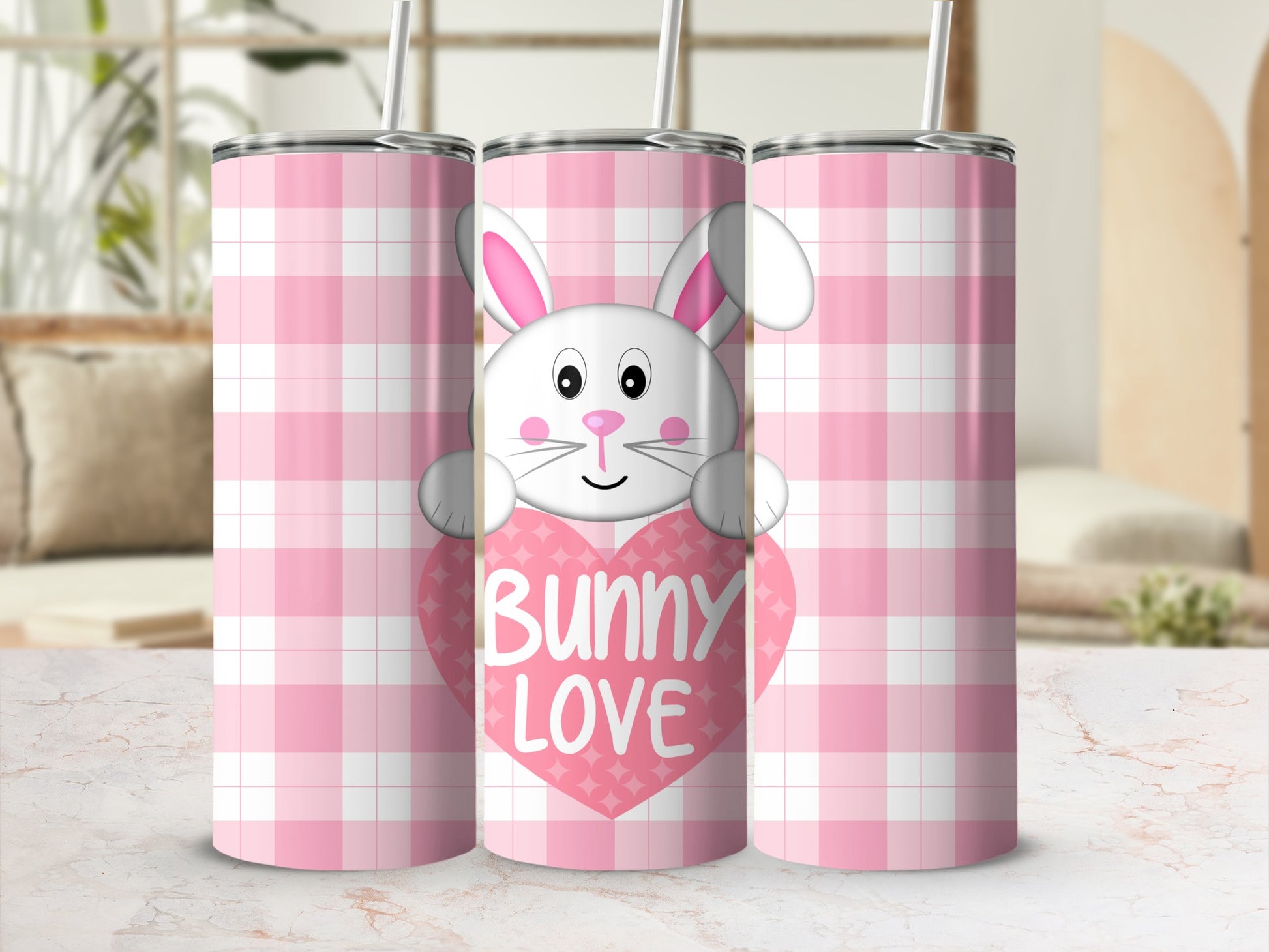Pink plaid tumbler with a cartoon bunny peeking from behind a heart.