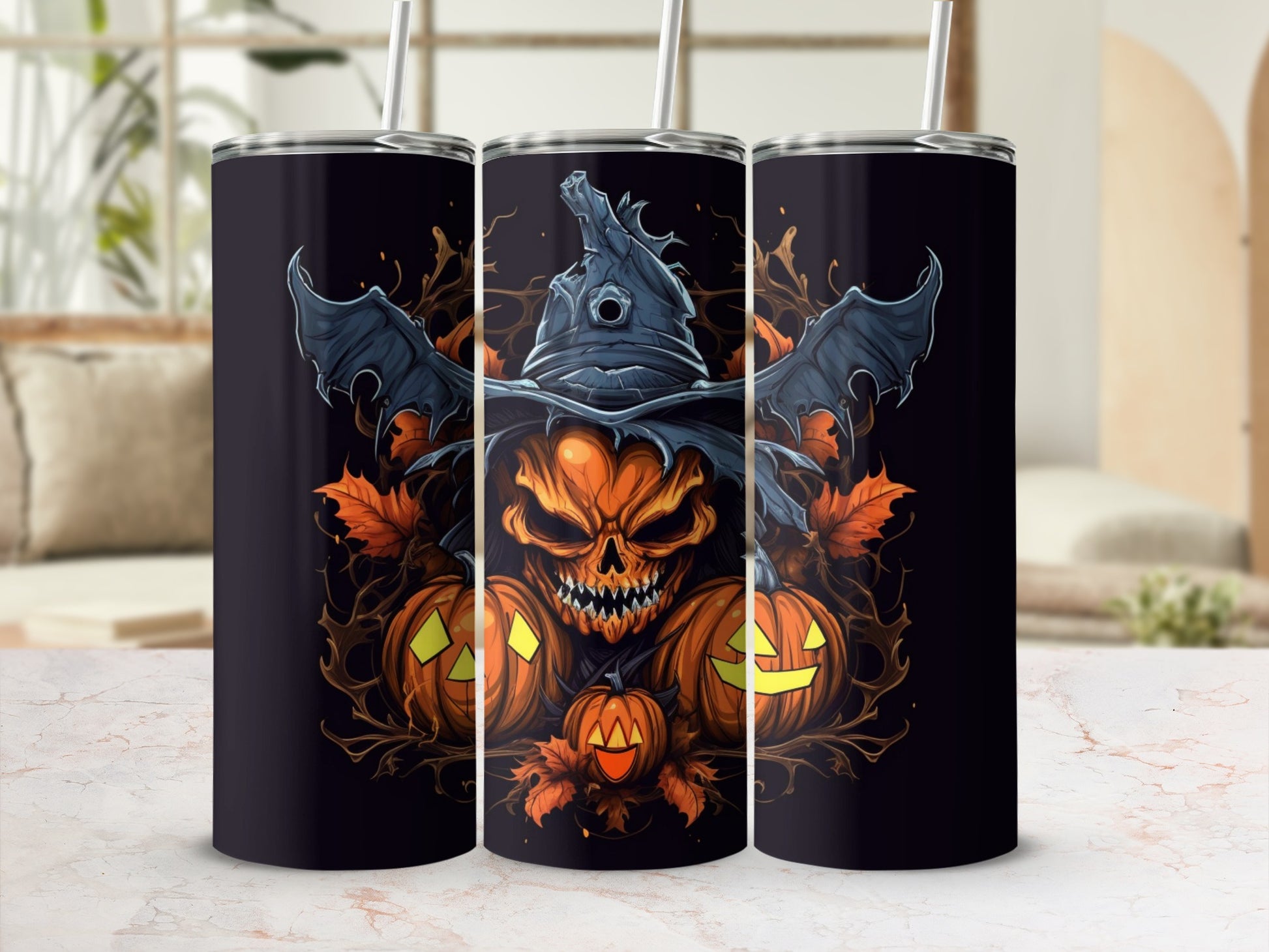 Three tumblers displaying a Halloween design with a skull, pumpkins, and autumn leaves.