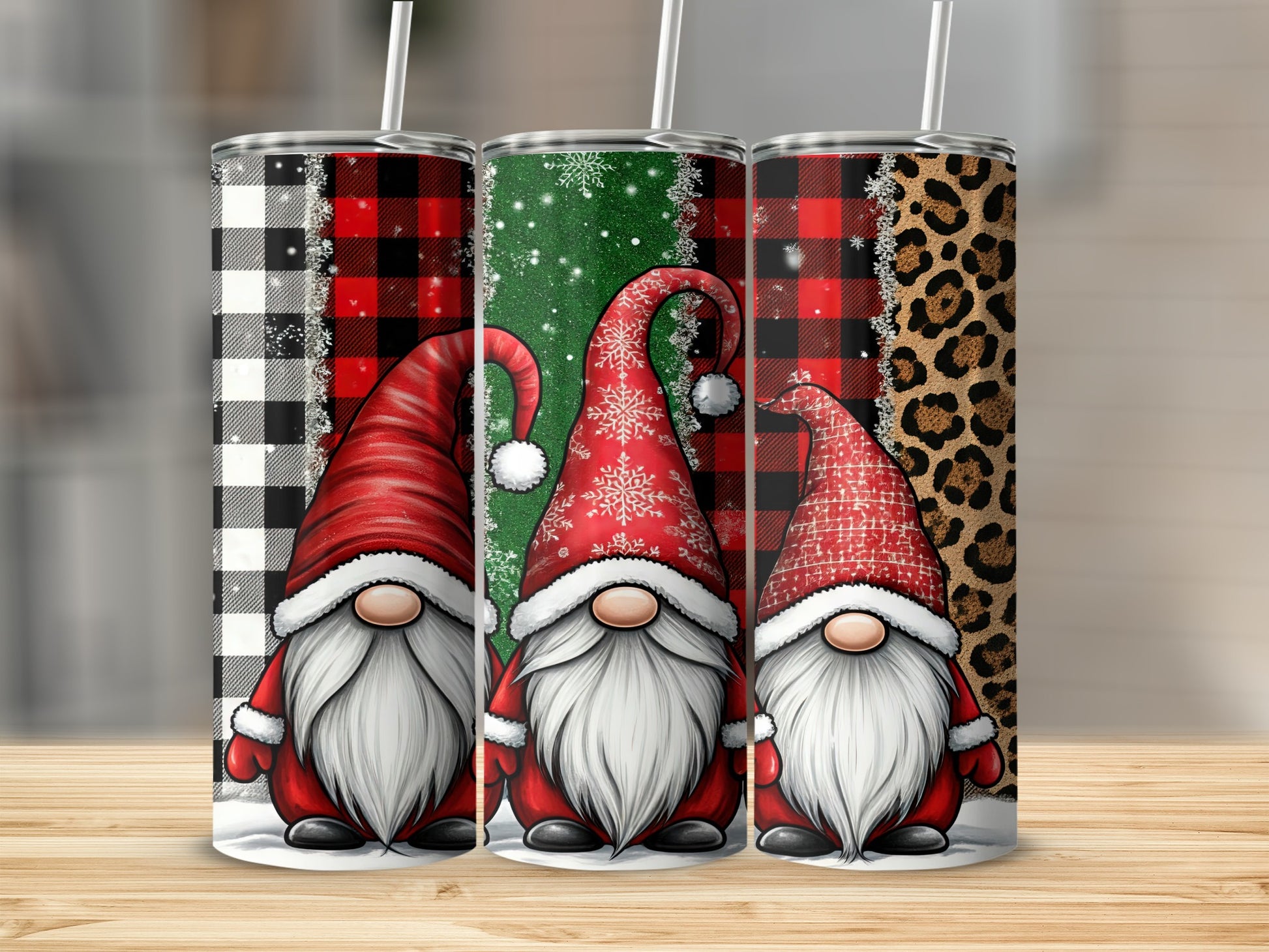 Three gnomes in red hats with holiday patterns on tumblers.