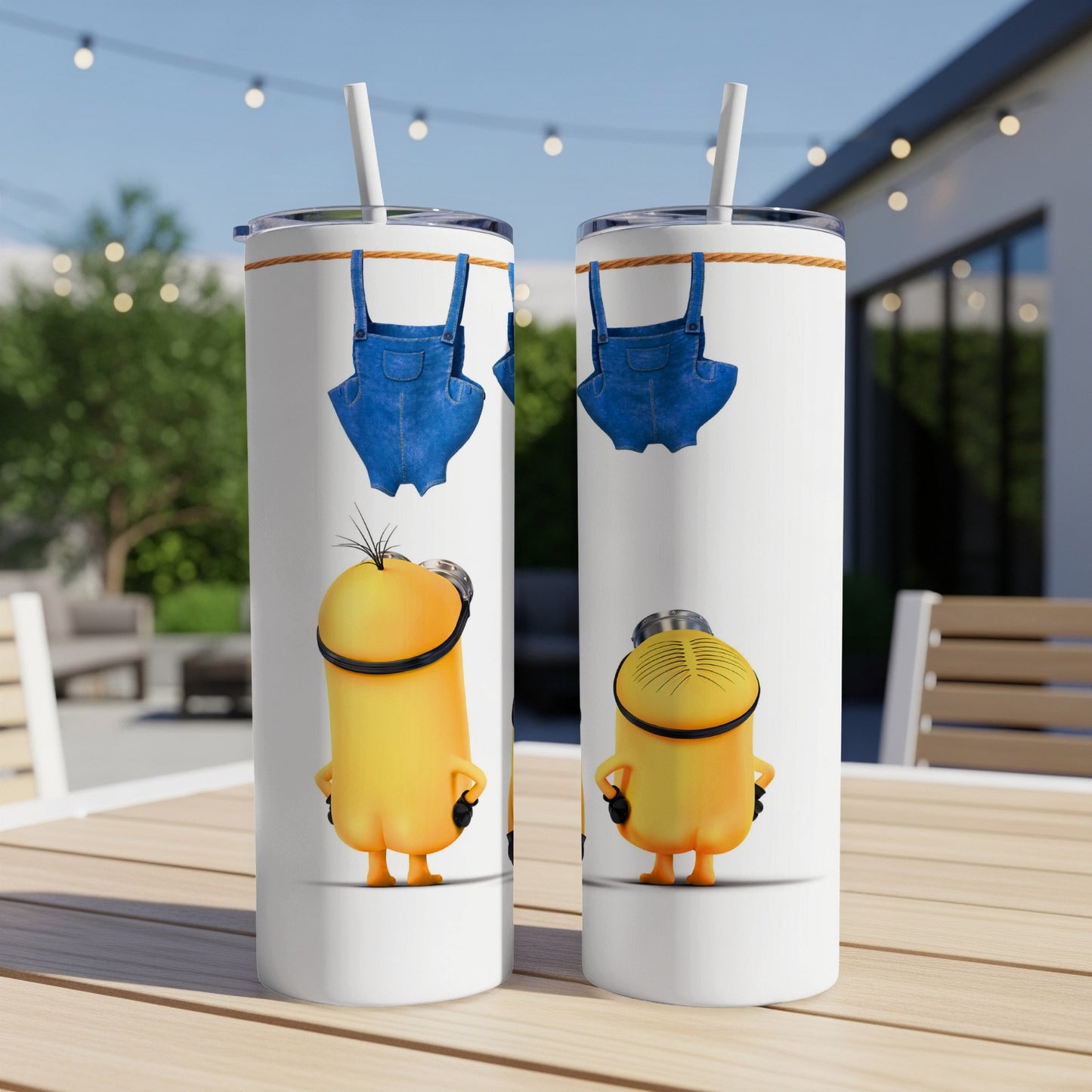 Two tall white tumblers with Minion characters and blue overalls.
