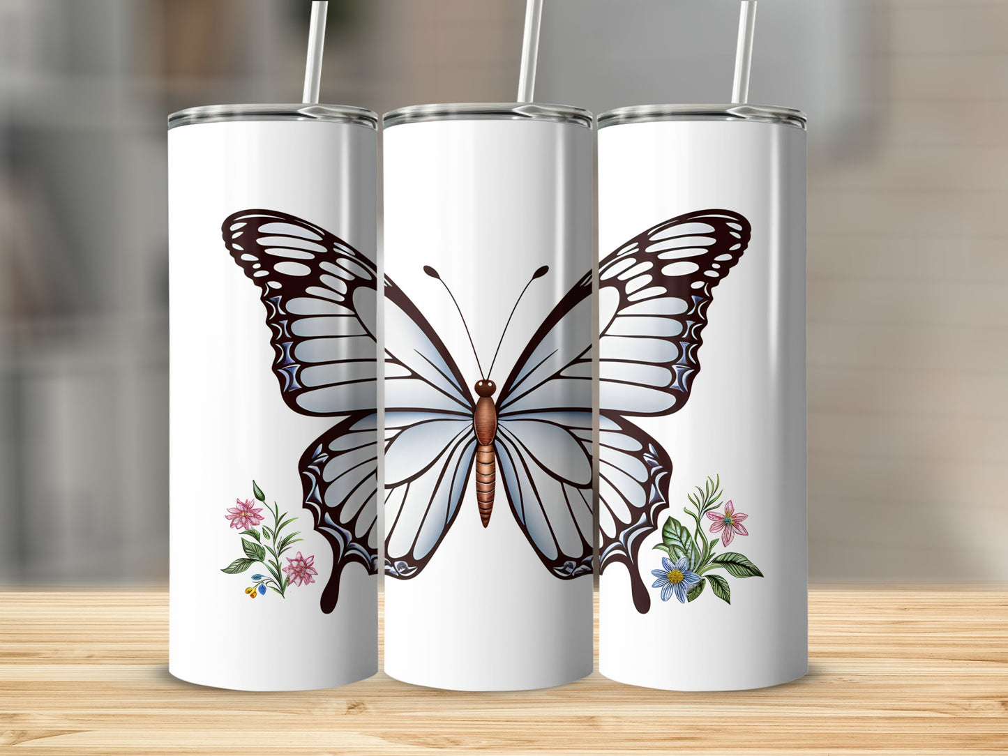 White tumbler with large blue butterfly and floral accents.
