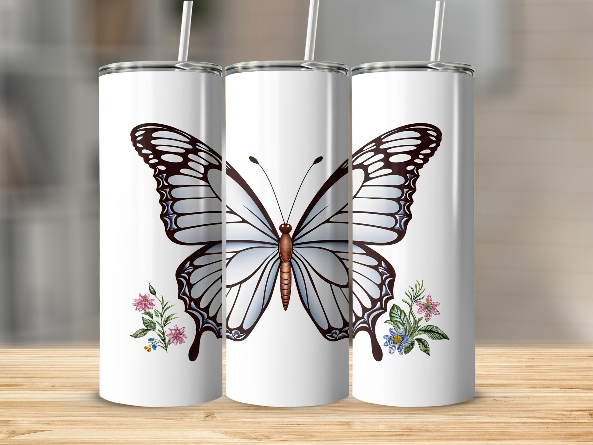 White tumbler with large blue butterfly and floral accents.