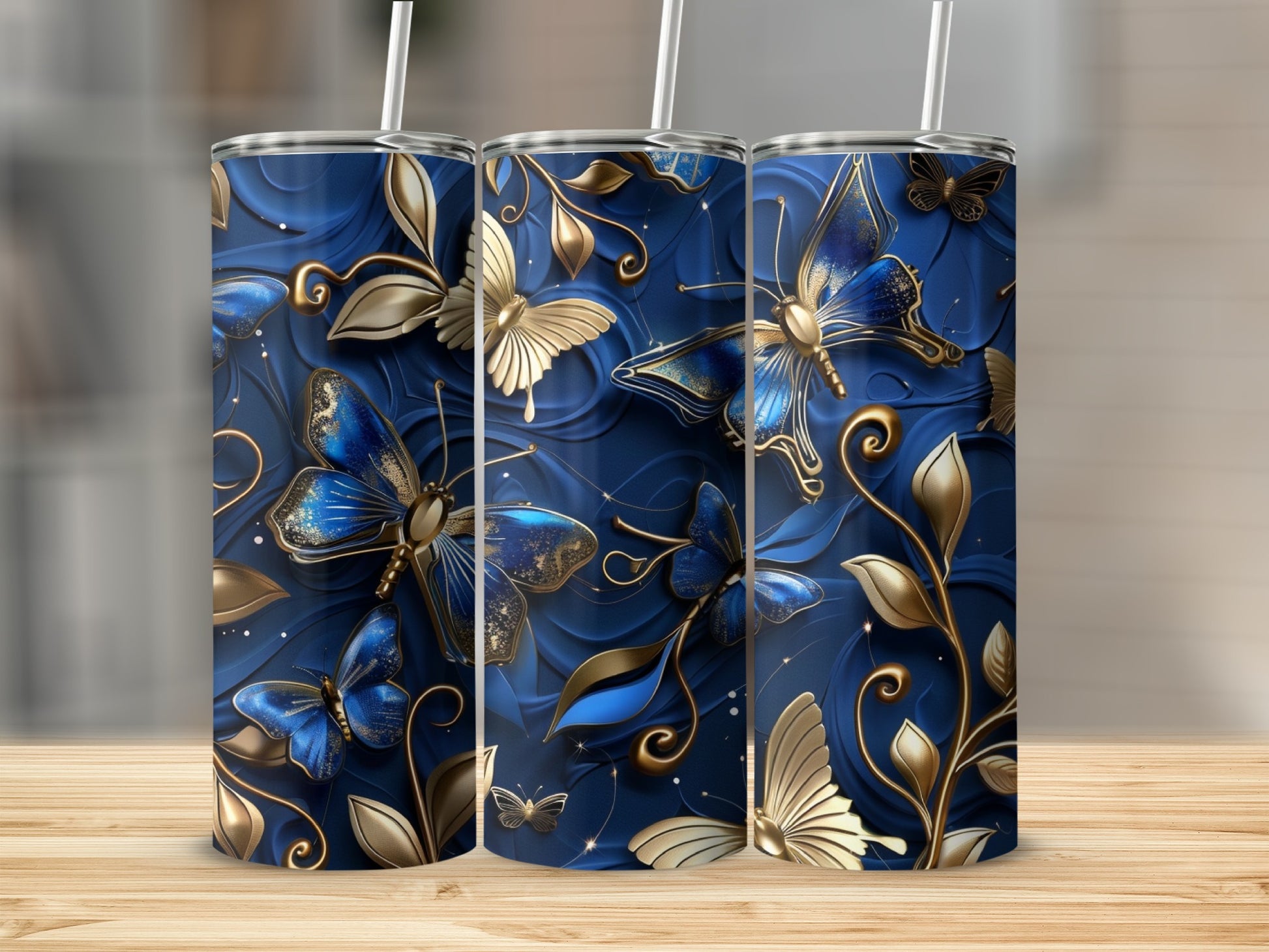 Blue tumbler with golden butterflies and floral accents.