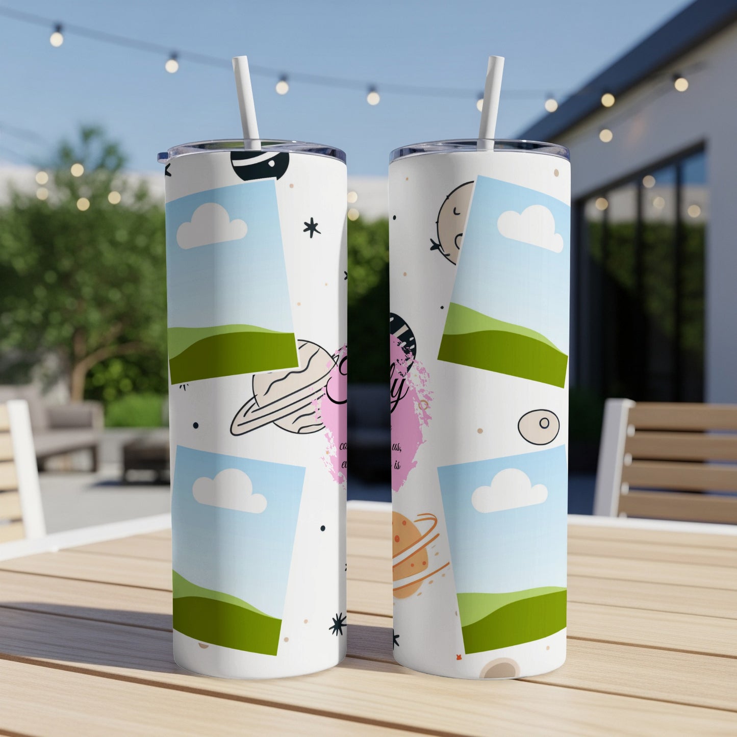 Two tumblers with a space-themed pattern featuring planets, clouds, and stars.