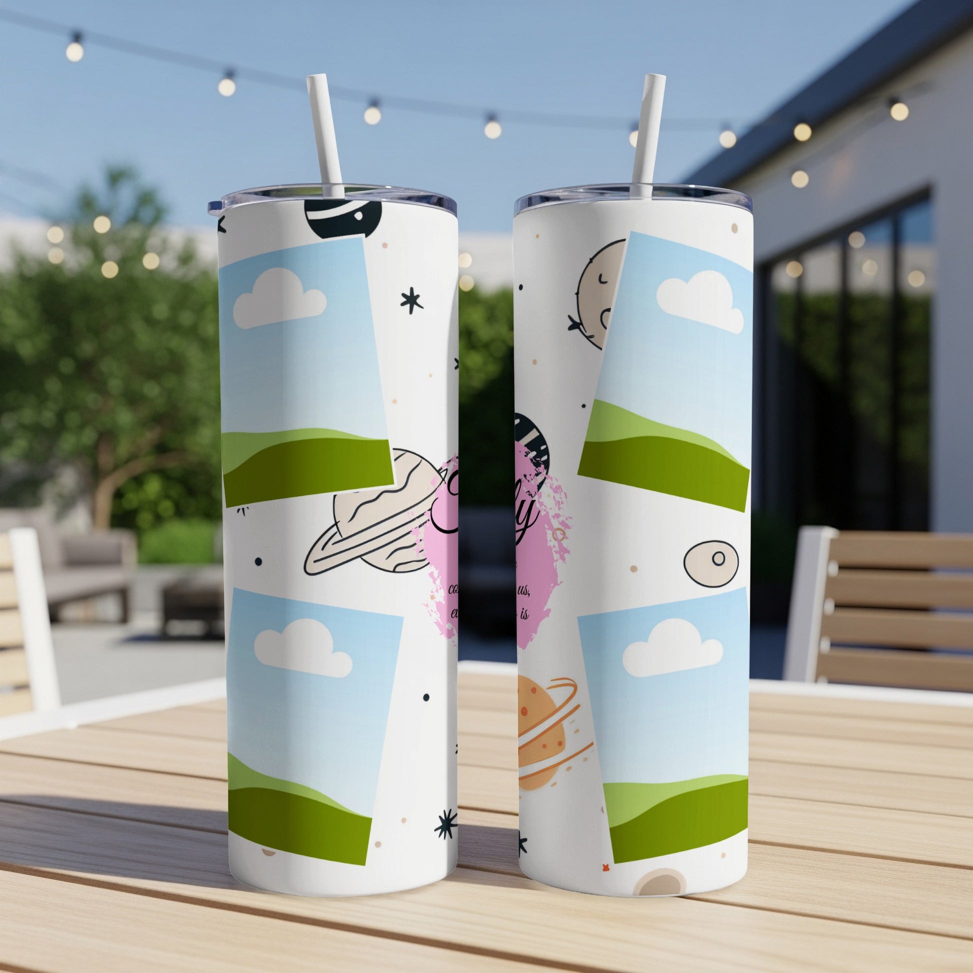 Two tumblers with a space-themed pattern featuring planets, clouds, and stars.