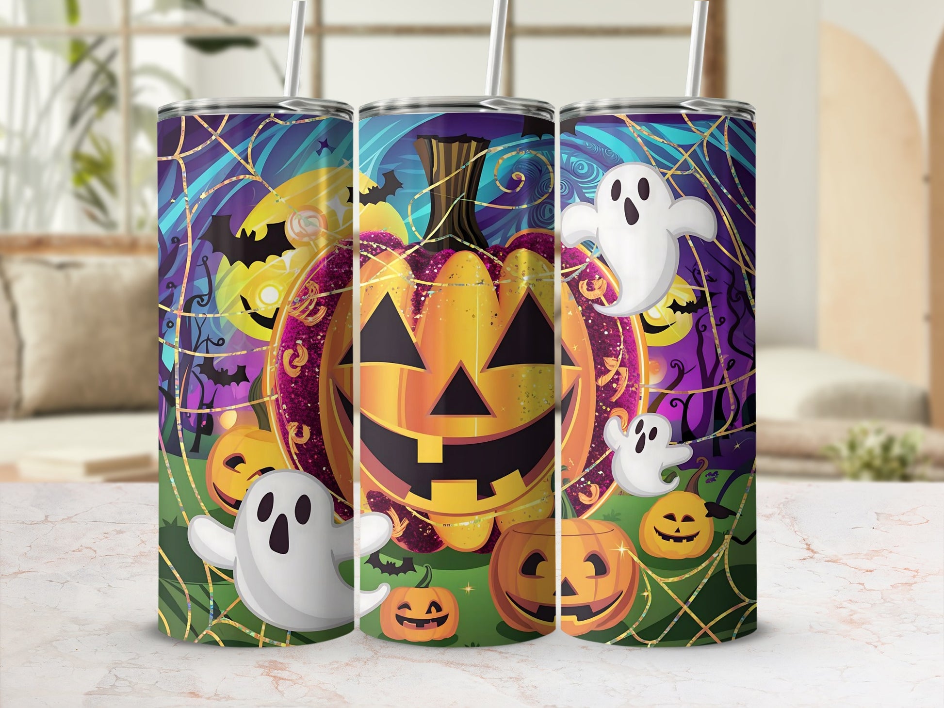 Three tumblers with a Halloween design featuring pumpkins, ghosts, bats, and spiderwebs.