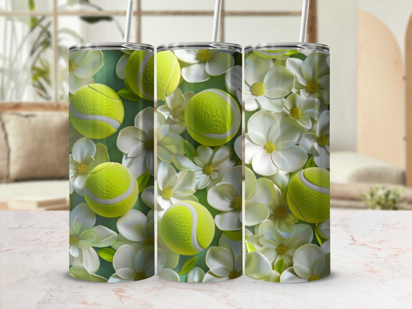 Three tumblers with a floral and tennis ball design.