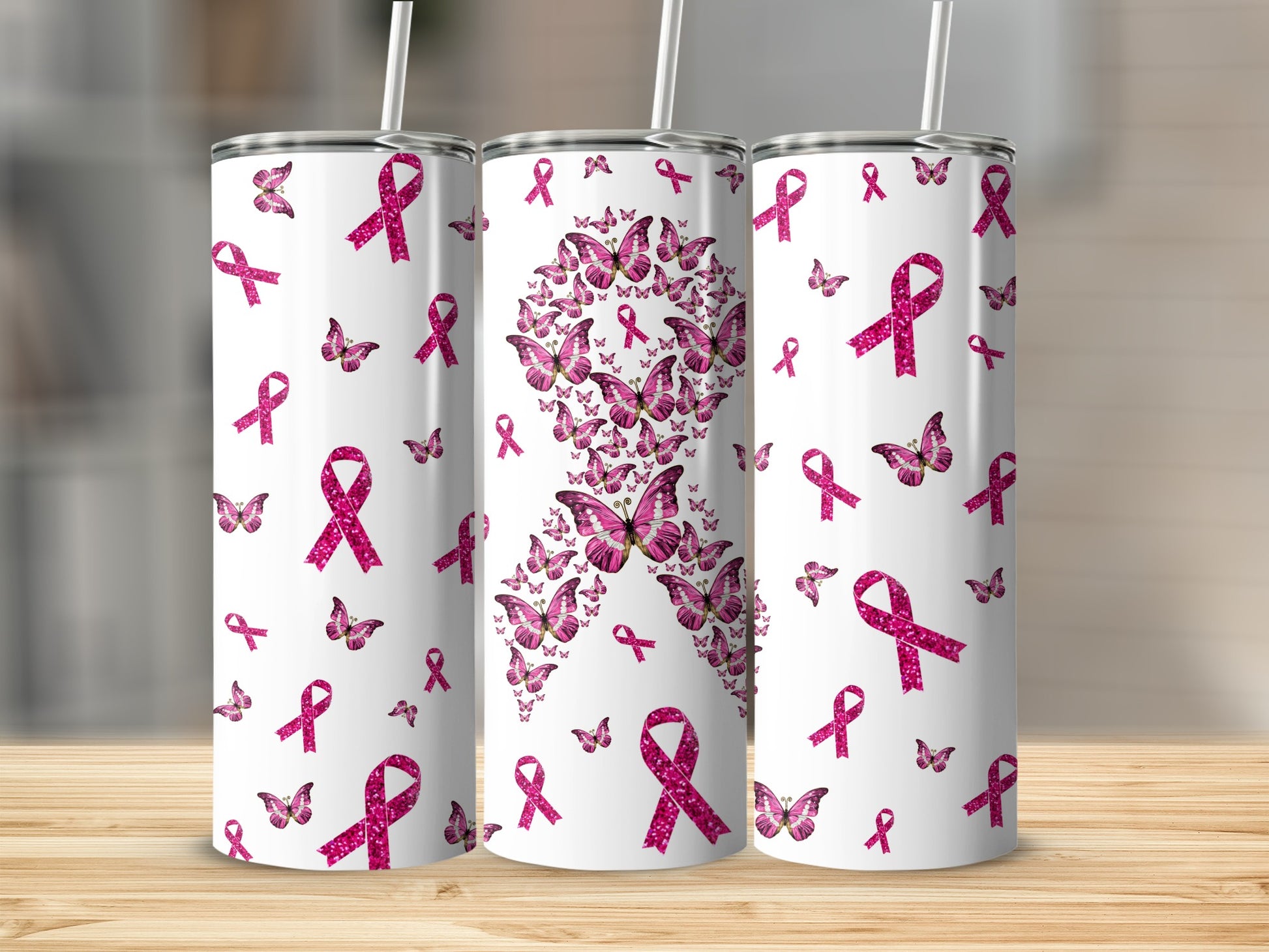 Pink ribbon butterfly design on three white tumblers.
