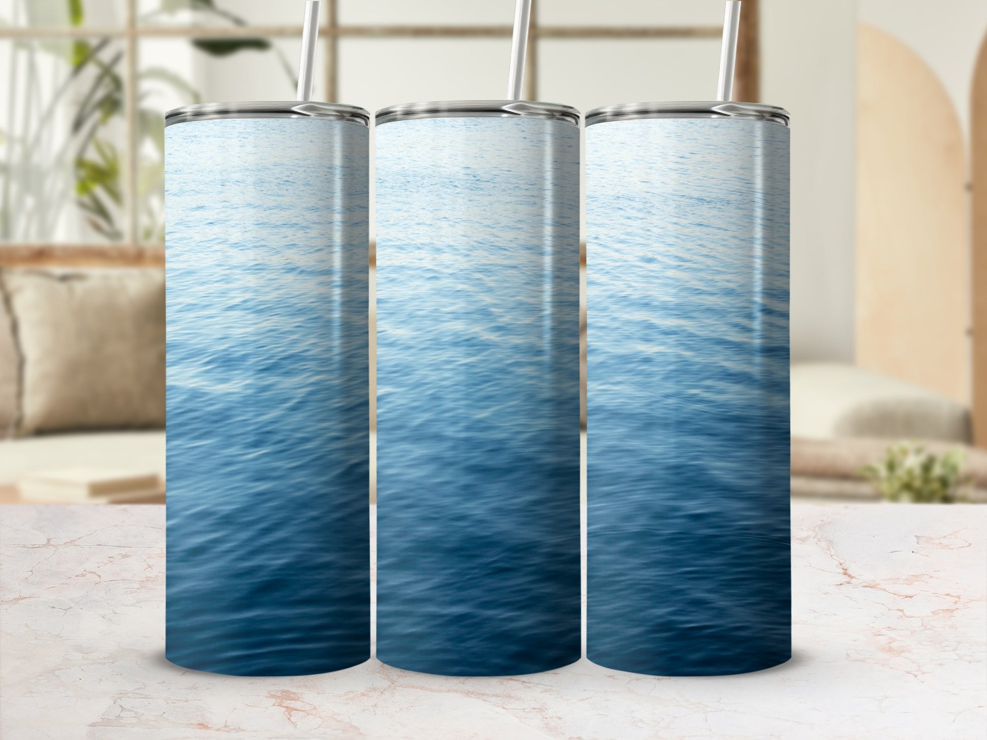 Three tall tumblers with a close-up blue water ripple pattern.