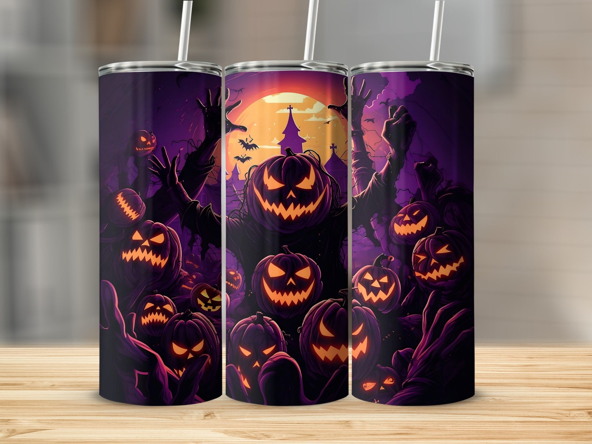Three tumblers with a spooky Halloween design featuring jack-o'-lanterns and dark figures.