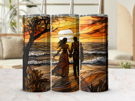 Couple walking on beach at sunset, stained glass design on tumblers.
