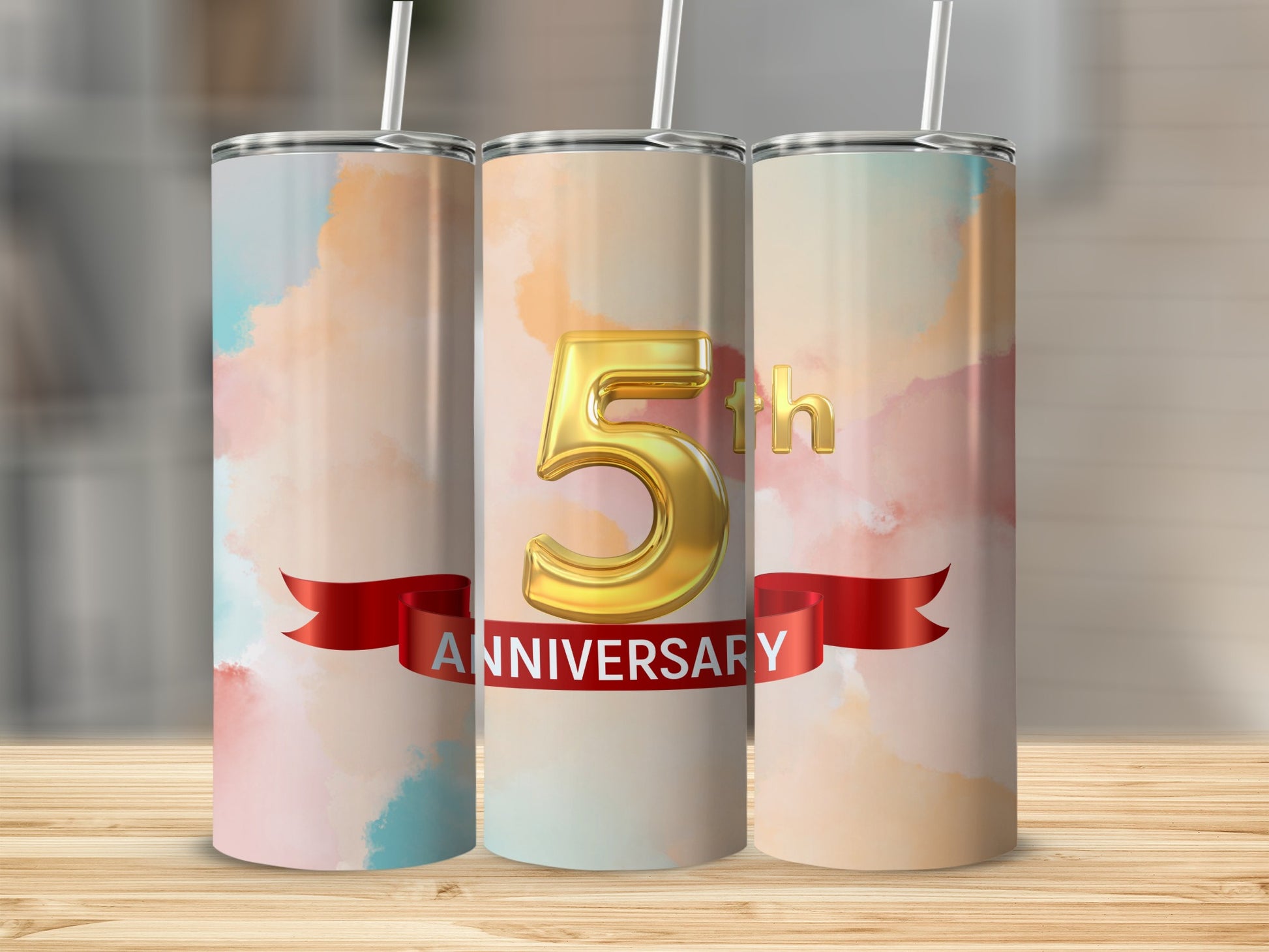 Gold "5" and "Anniversary" text on a watercolor tumbler with red ribbon.