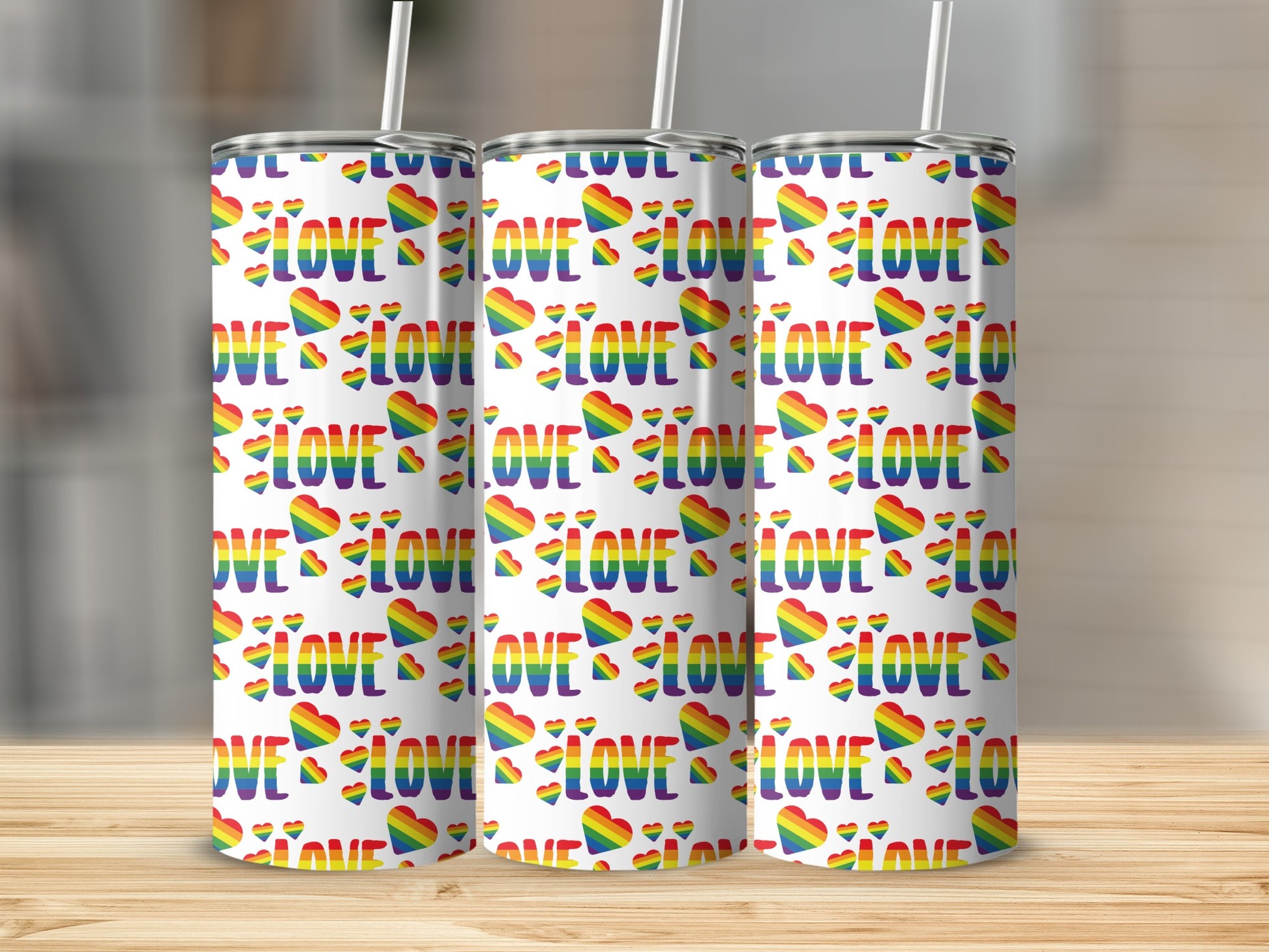 White tumblers with repeating rainbow heart and "LOVE" pattern.