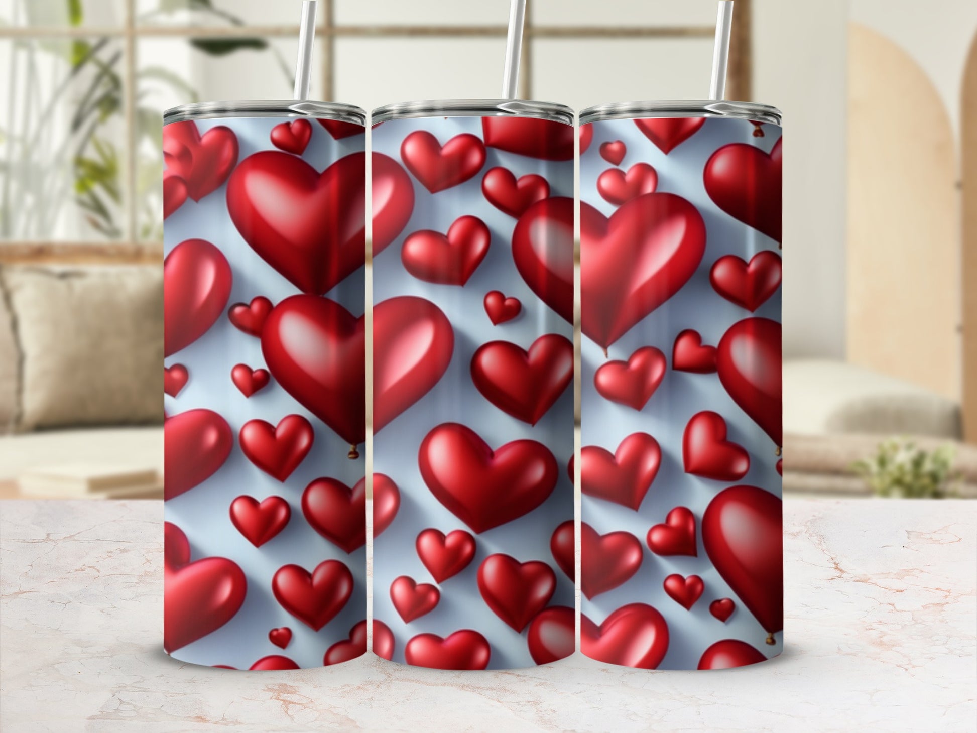 Three tumblers with a repeating pattern of red hearts on a light blue background.